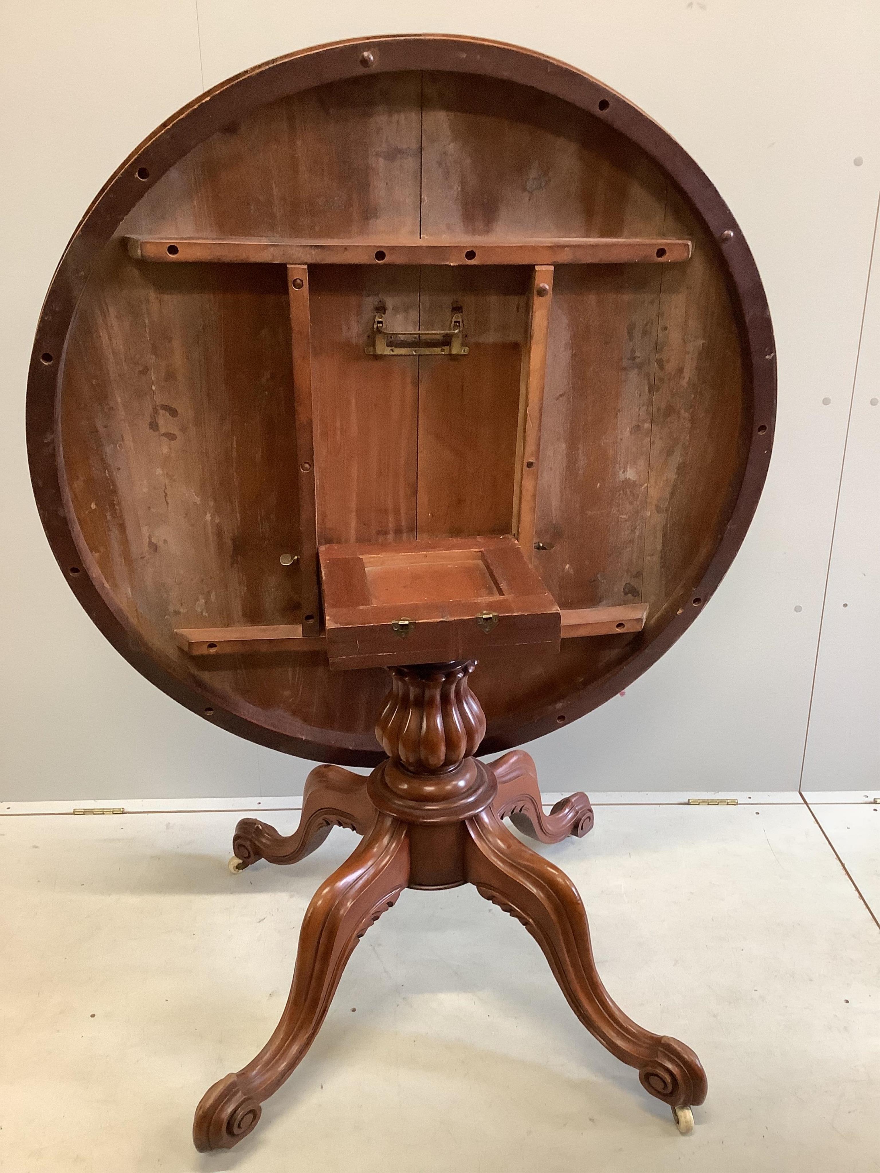 A Victorian circular mahogany tilt top breakfast table, diameter 118cm, height 77cm together with a harlequin set of six William IV mahogany and simulated rosewood dining chairs. Condition - fair